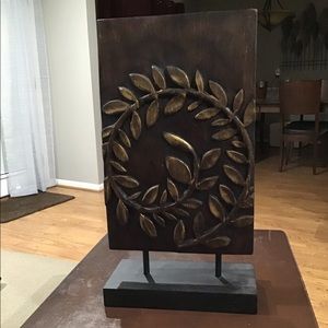 Decorative wooden piece with gold accents